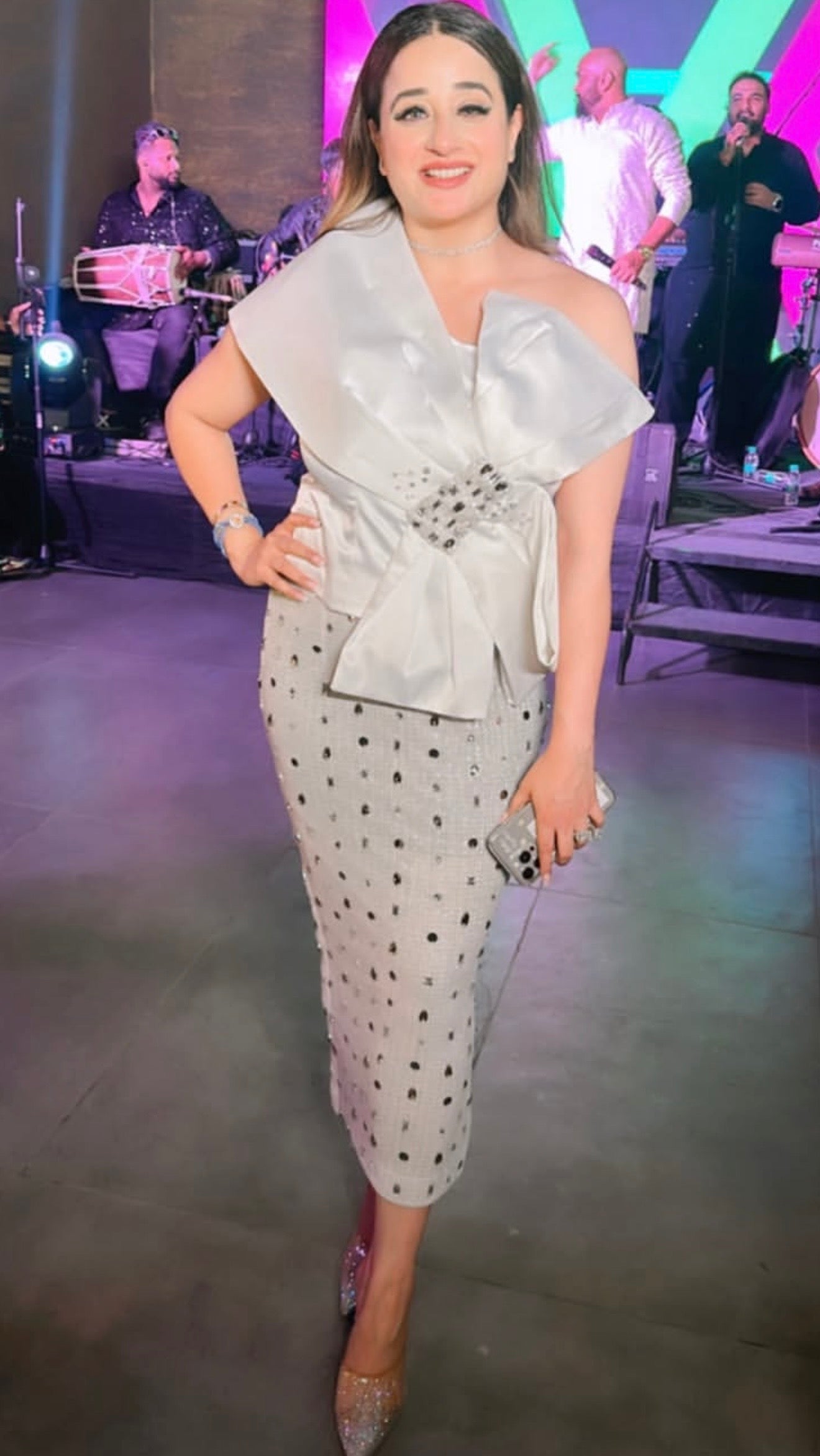 Classic , Timeless and Oh -so -Chic in white .

 @life.of.bobbyuppal  looking Ravishing in our white tube top wrapped with satin pleating flaps  and pencil fit calf length skirt with crystal embellishments .